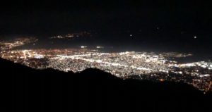 view of city lights from mountain