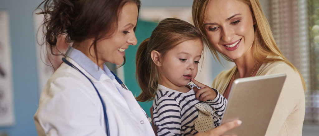 doctor with mom and child